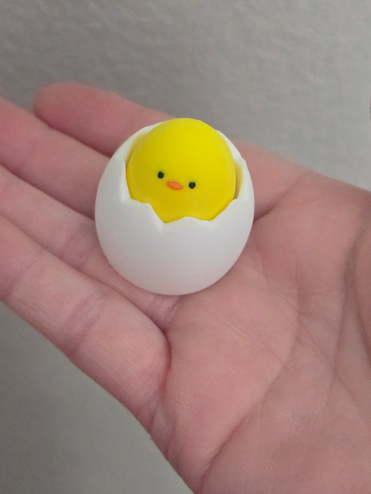 3D printed Egg with chick fidget clicker