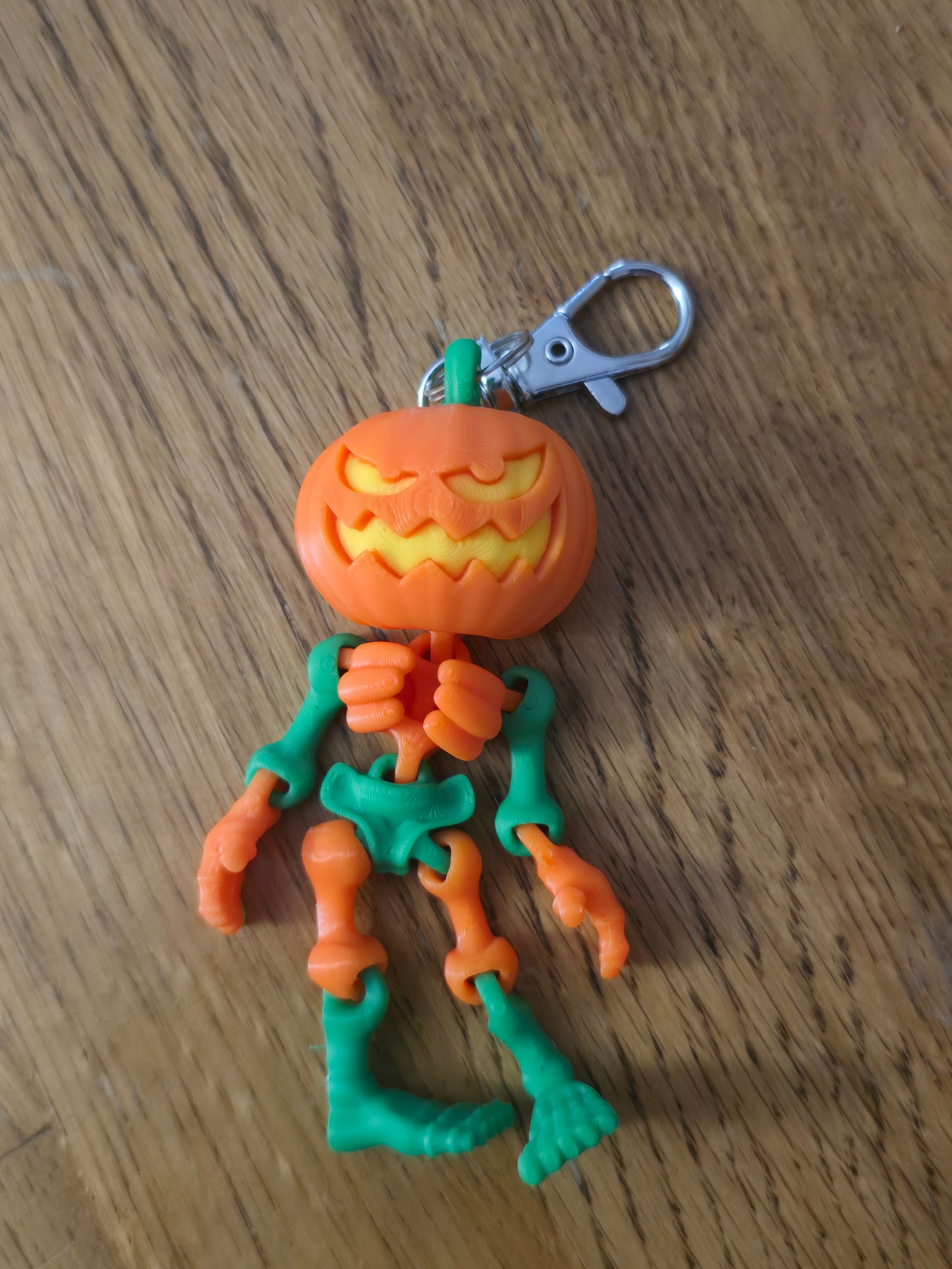 3D printed articulated Halloween pumpkin skeleton keychains